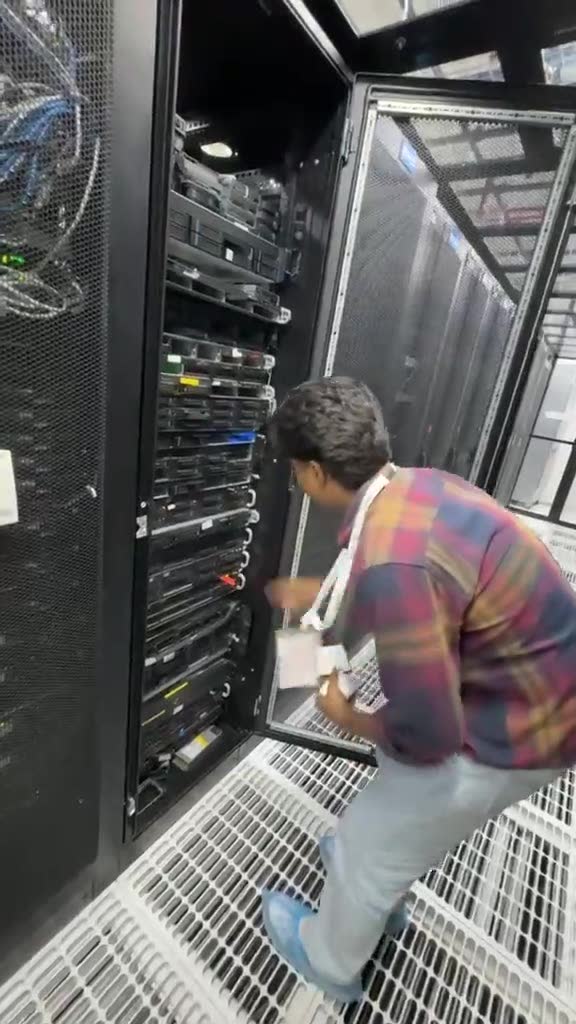 eWebGuru engineer working at an open server rack inside a CtrlS Tier IV datacentre in India