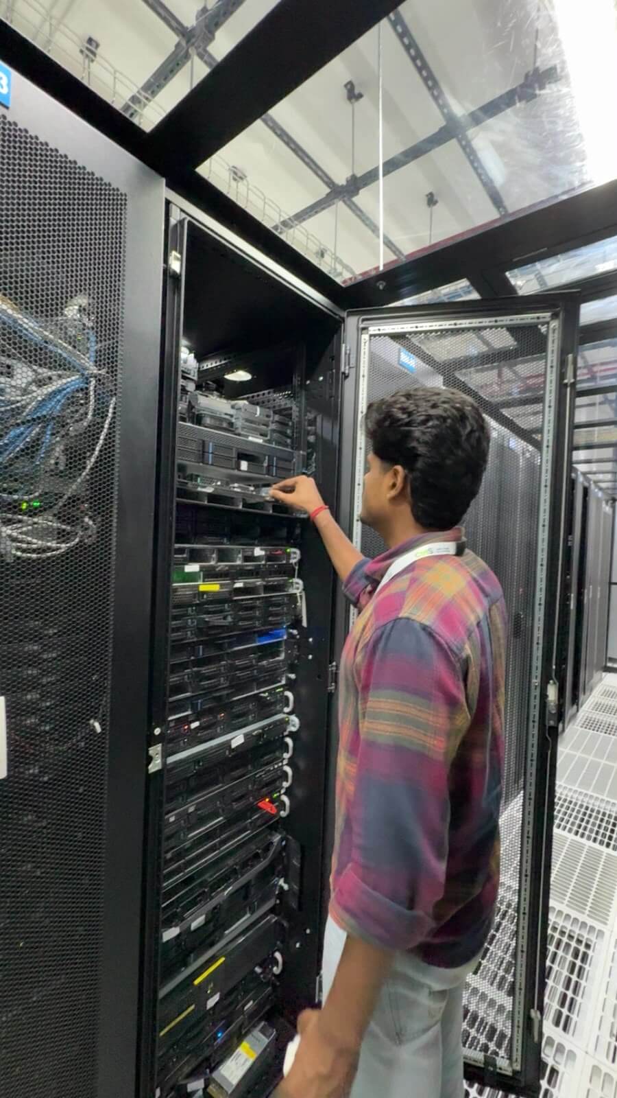 eWebGuru engineer racking a dedicated server ahead of Windows Server provisioning